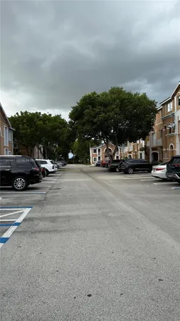 a view of street with parked cars