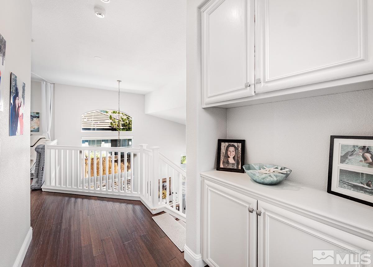 3095 Roxbury Drive Reno, NV 89523 - Photo 21 of 36 a hallway with white cabinets and wooden floor