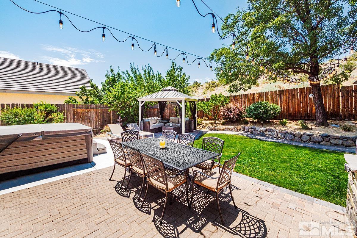 3095 Roxbury Drive Reno, NV 89523 - Photo 26 of 36 a view of a patio with furniture and a yard