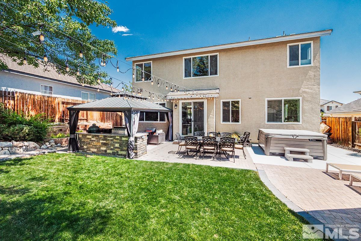 3095 Roxbury Drive Reno, NV 89523 - Photo 29 of 36 a view of a patio with couches chairs and a big yard