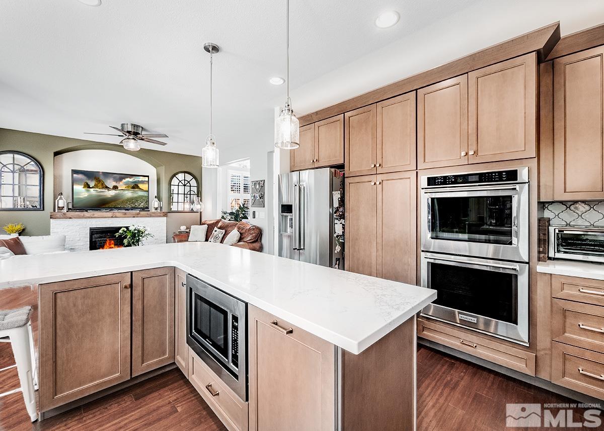 3095 Roxbury Drive Reno, NV 89523 - Photo 9 of 36 a kitchen with a sink stove and refrigerator
