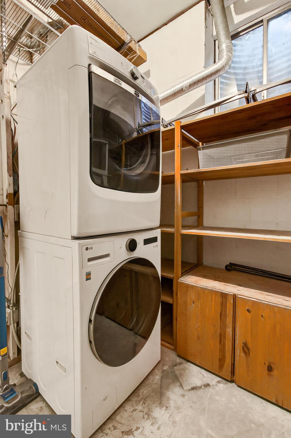5833 Royal Ridge Drive, Unit 943 Springfield, VA 22152 - Photo 43 of 45 a utility room with dryer and washer