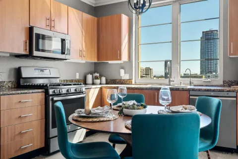 a dining room with furniture a window and kitchen view