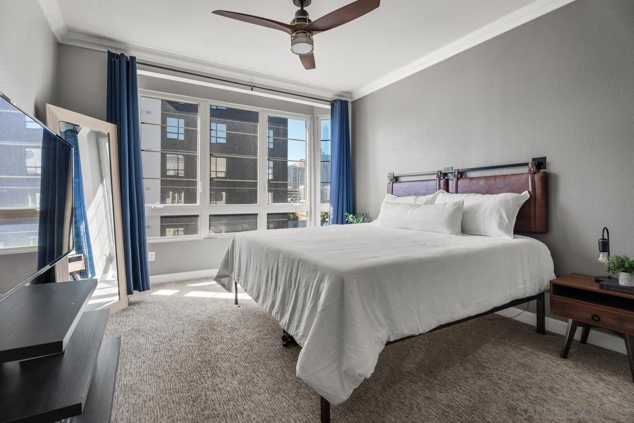 1400 Broadway, Unit 1505 San Diego, CA 92101 - Photo 11 of 34 a bedroom with a bed tv and a large window