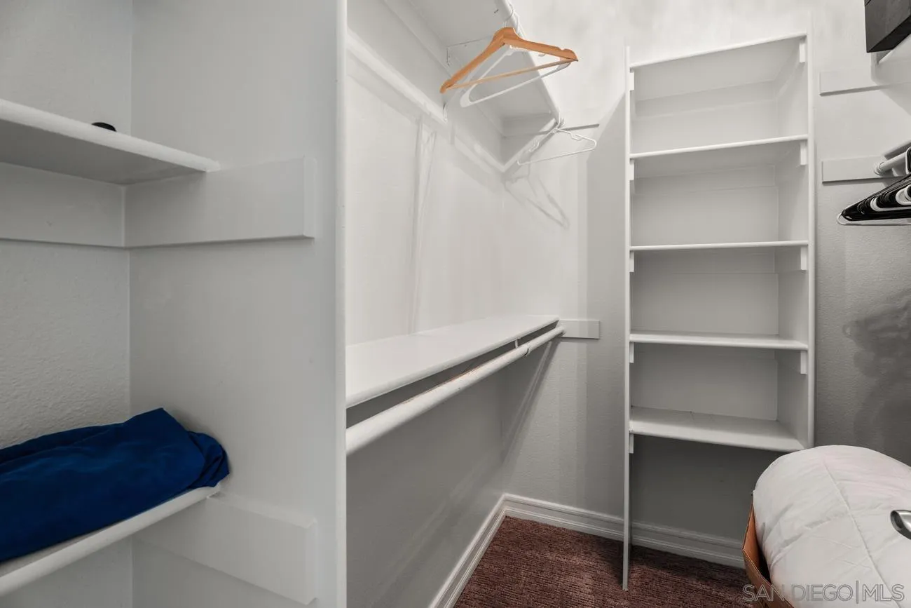 1400 Broadway, Unit 1505 San Diego, CA 92101 - Photo 16 of 34 a view of walk in closet with empty racks