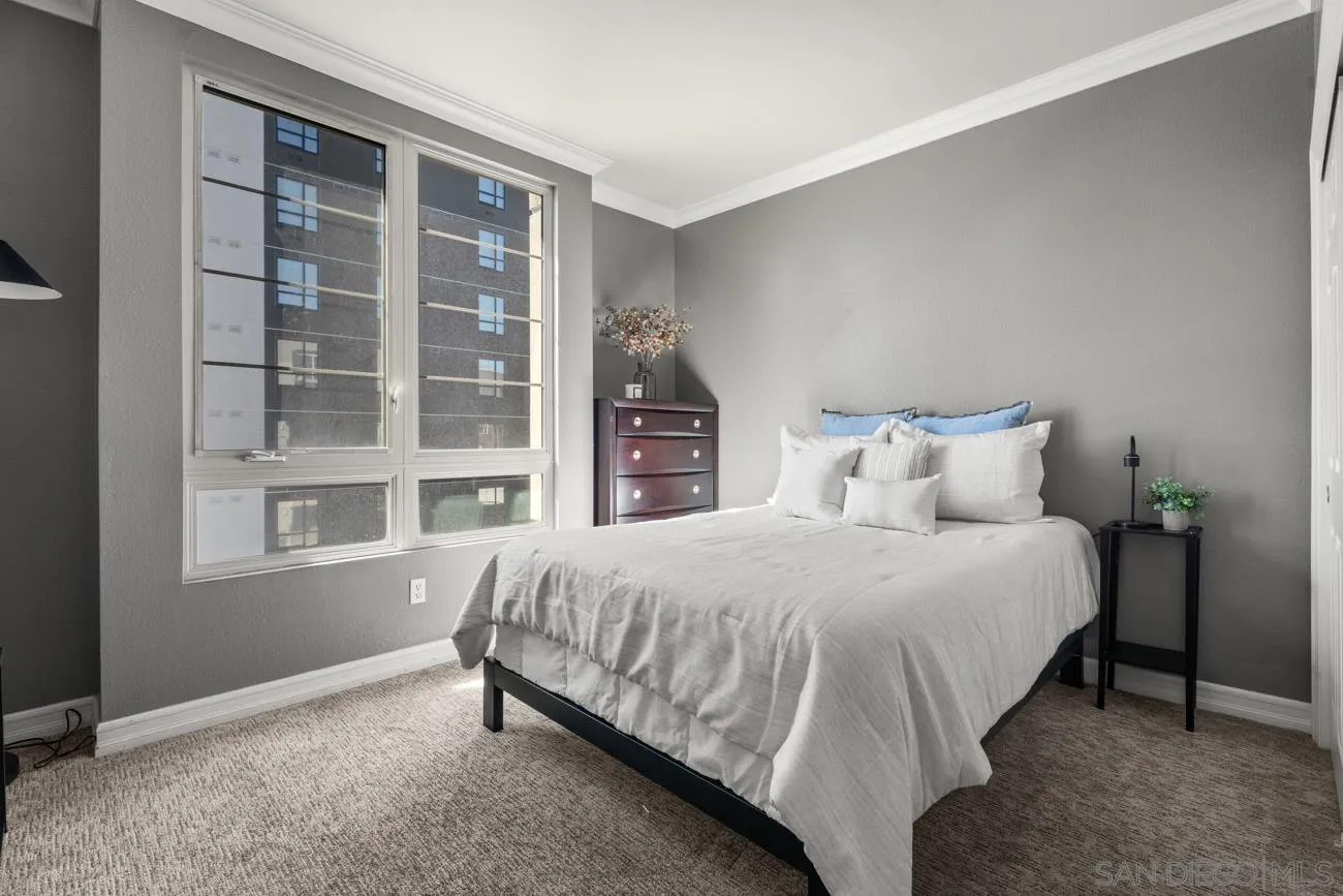 1400 Broadway, Unit 1505 San Diego, CA 92101 - Photo 19 of 34 a bedroom with a bed and a window