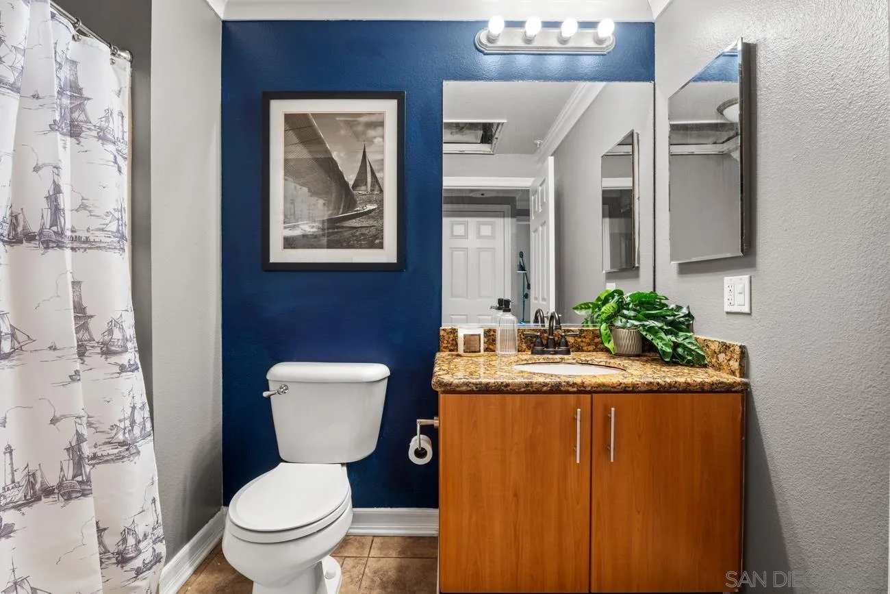 1400 Broadway, Unit 1505 San Diego, CA 92101 - Photo 21 of 34 a white toilet sitting next to a bathroom sink