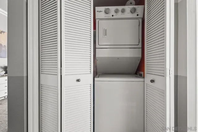 a view of parking garage with cars parked