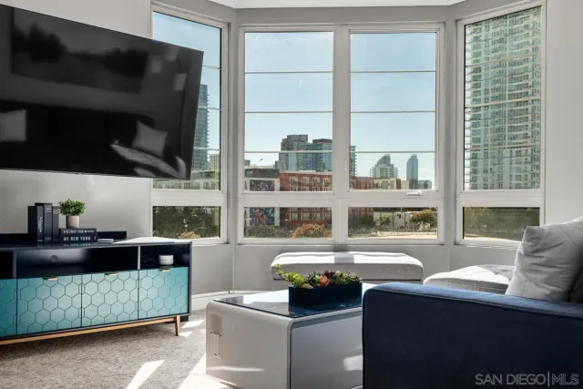 a living room with furniture fireplace and a flat screen tv