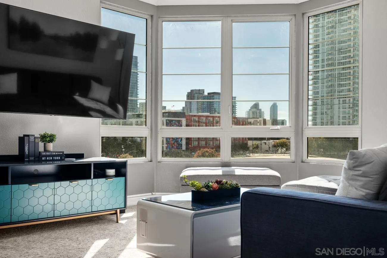 1400 Broadway, Unit 1505 San Diego, CA 92101 - Photo 6 of 34 a living room with furniture a flat screen tv and a window