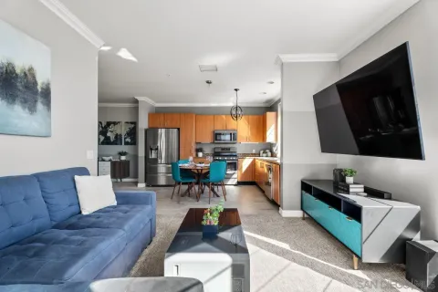 a view of a livingroom with kitchen and furniture