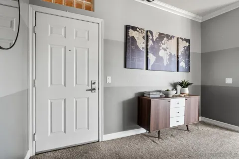 a bedroom with furniture and a window