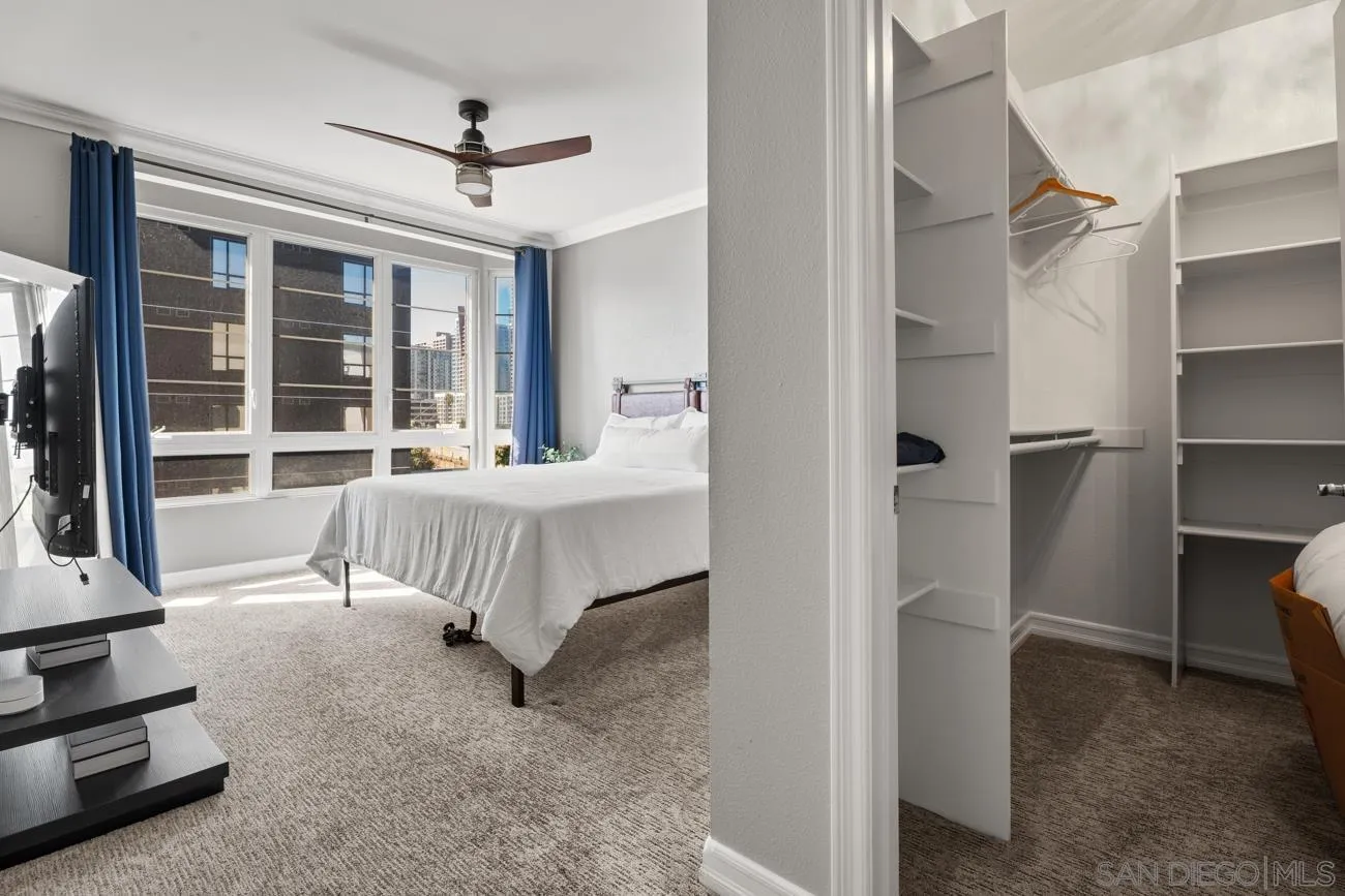 1400 Broadway, Unit 1505 San Diego, CA 92101 - Photo 10 of 34 a bedroom with furniture and a window