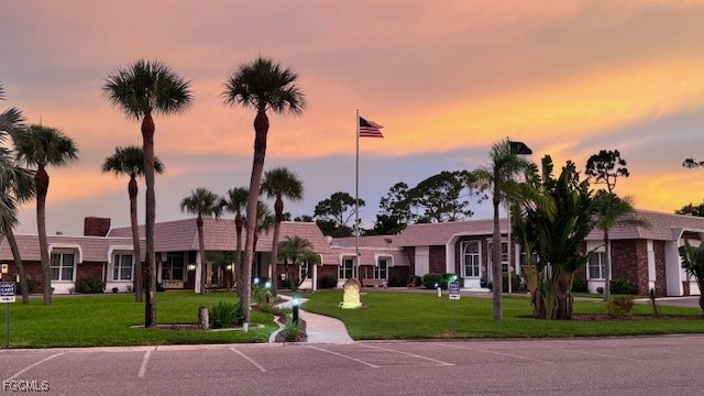 5520 Colonial Road North Fort Myers, FL 33917 - Photo 31 of 44 a view of a white house with a yard and palm trees