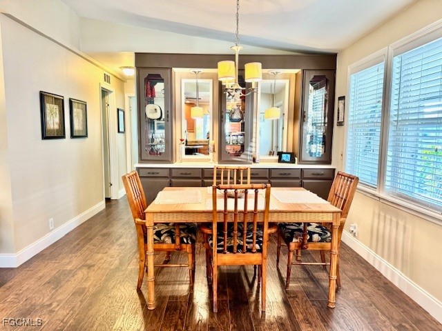 5520 Colonial Road North Fort Myers, FL 33917 - Photo 5 of 44 a dining room with furniture a chandelier and wooden floor