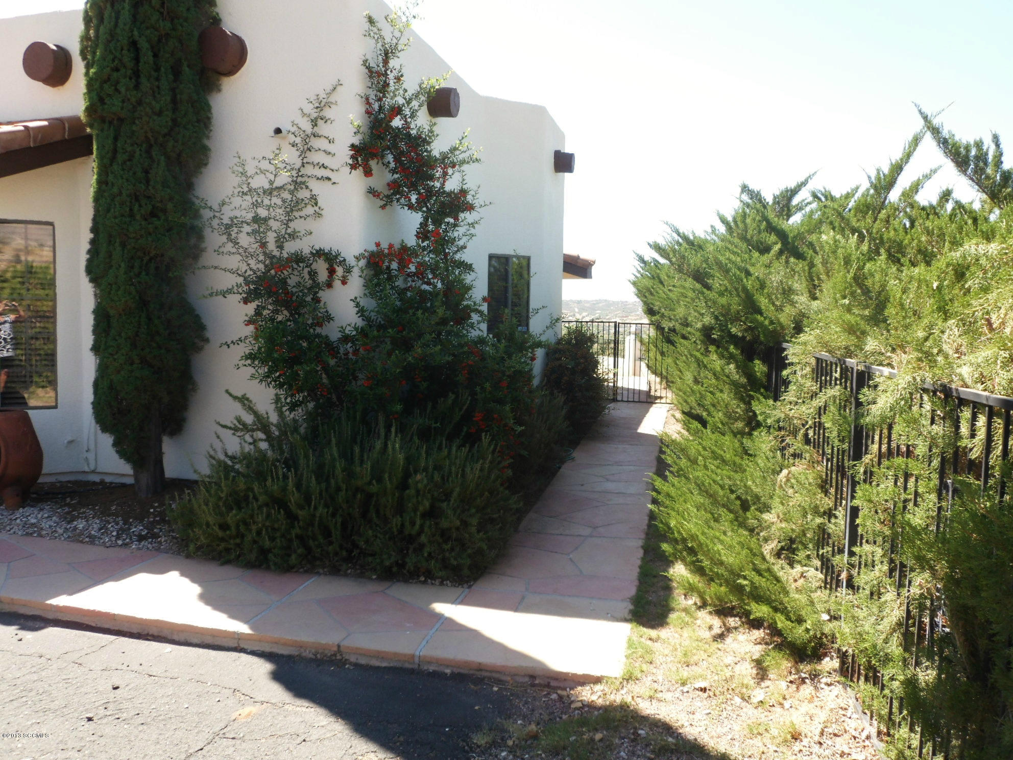 293 Cuenta Court Rio Rico, AZ 85648 - Photo 2 of 25 a view of a pathway both side of the house