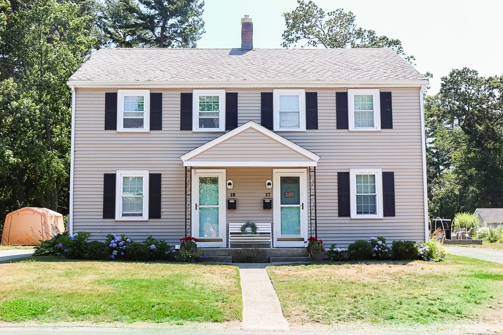a front view of a house with a yard