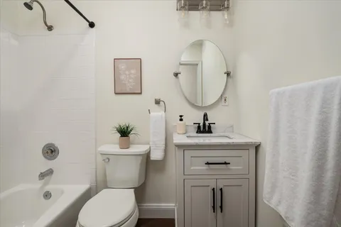 a bathroom with a sink a toilet and a bathtub