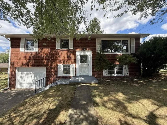 a front view of a house with a garage
