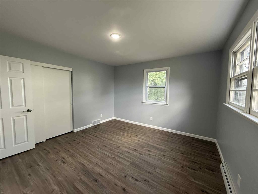 34 Lexington Avenue Uniontown, PA 15401 - Photo 17 of 29 an empty room with wooden floor and windows