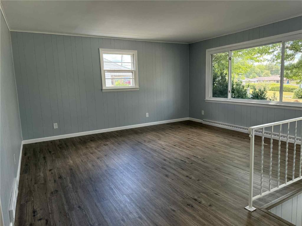 34 Lexington Avenue Uniontown, PA 15401 - Photo 2 of 29 an empty room with wooden floor and windows