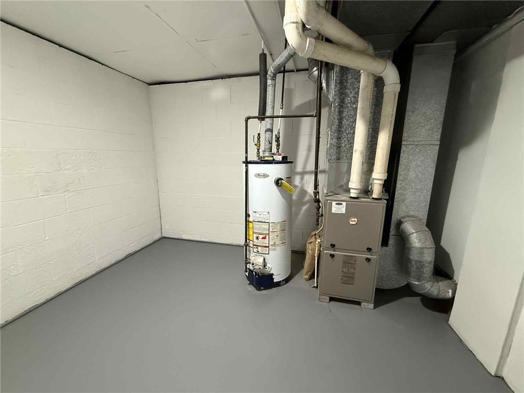 34 Lexington Avenue Uniontown, PA 15401 - Photo 26 of 29 an empty room with staircase and mirror