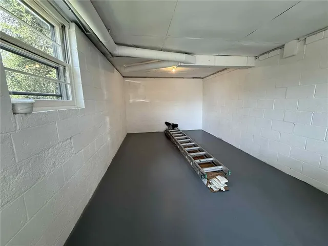 a view of an empty room with windows