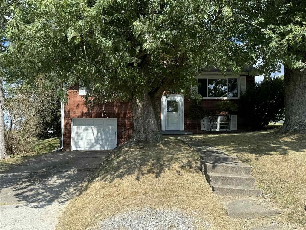 34 Lexington Avenue Uniontown, PA 15401 - Photo 29 of 29 a front view of a house with a yard and garage