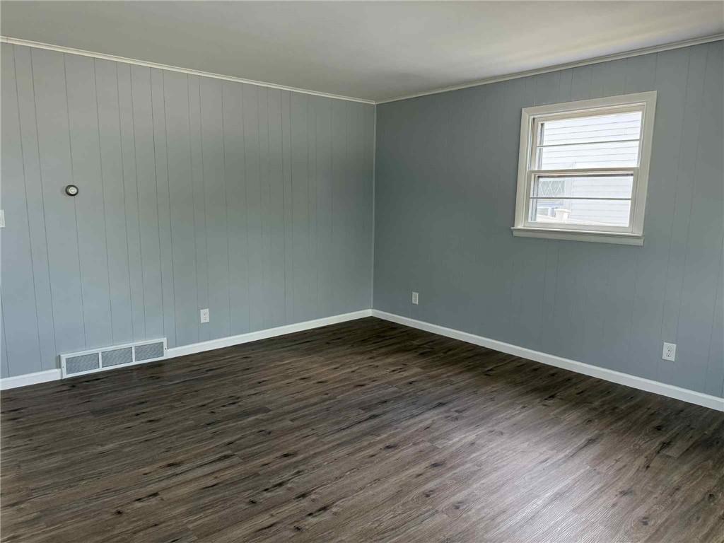 34 Lexington Avenue Uniontown, PA 15401 - Photo 3 of 29 a view of an empty room with wooden floor and a window