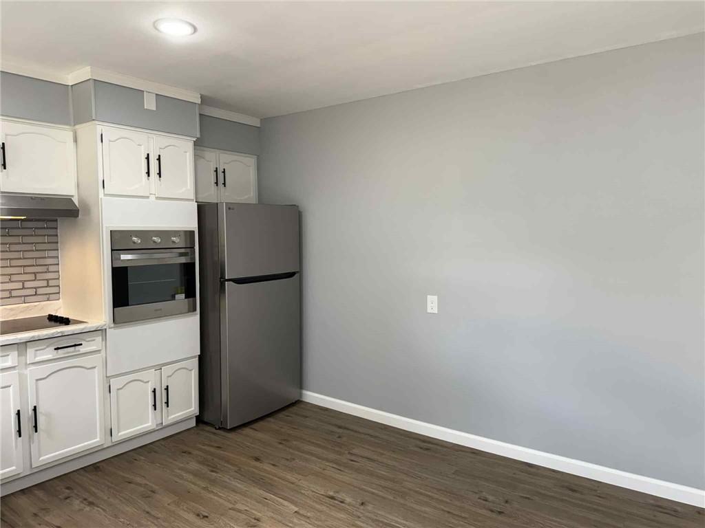34 Lexington Avenue Uniontown, PA 15401 - Photo 8 of 29 a kitchen with a refrigerator and a stove top oven