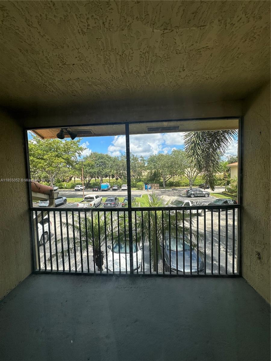 1245 Southwest 46th Avenue, Unit 1202 Pompano Beach, FL 33069 - Photo 6 of 6 a view of a balcony with lake view