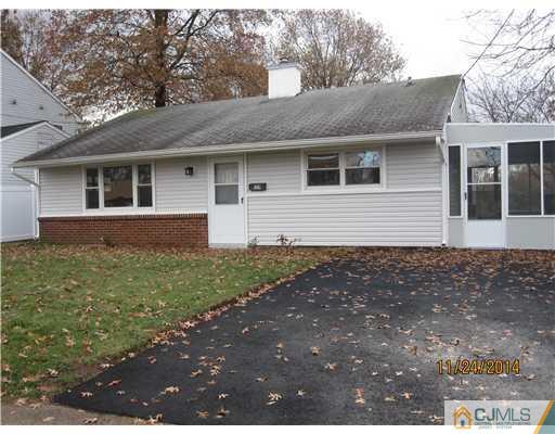 139 Winthrop Road Edison, NJ 08817 - Photo 1 of 17 a front view of a house with garden