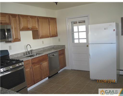 139 Winthrop Road Edison, NJ 08817 - Photo 9 of 17 a kitchen with a sink stove and refrigerator