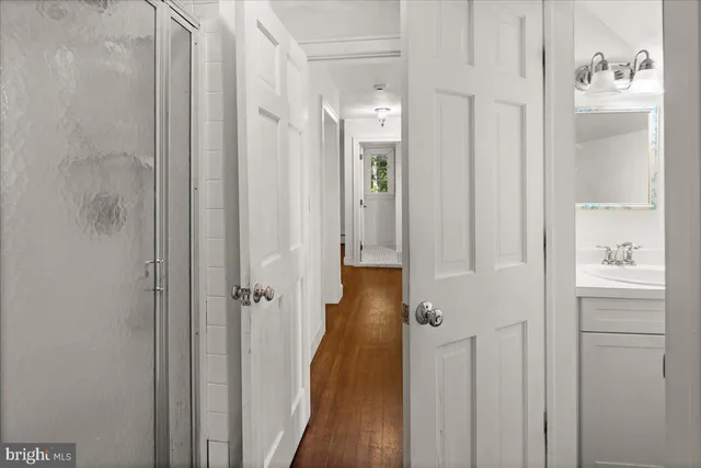 a bed room with a bed and a chair