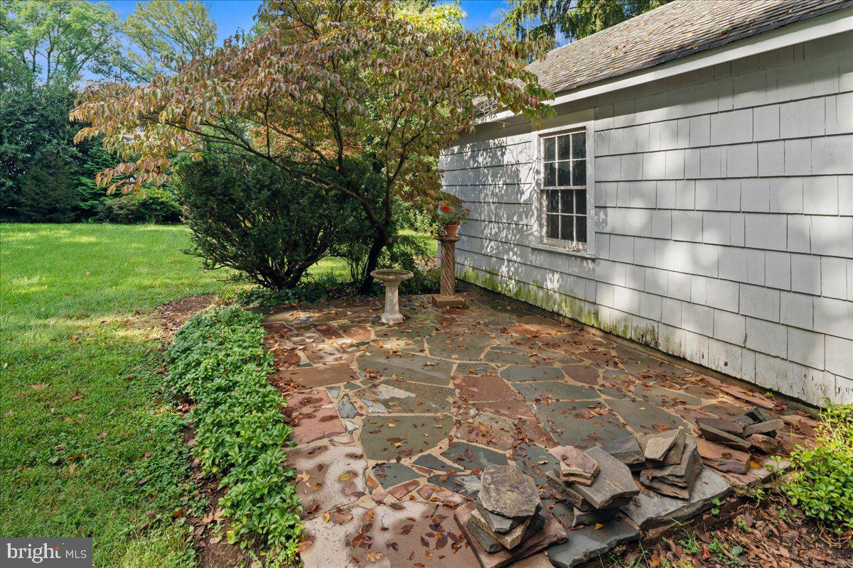 160 Springdale Road Princeton, NJ 08540 - Photo 31 of 38 Stone patio on side of the garage
