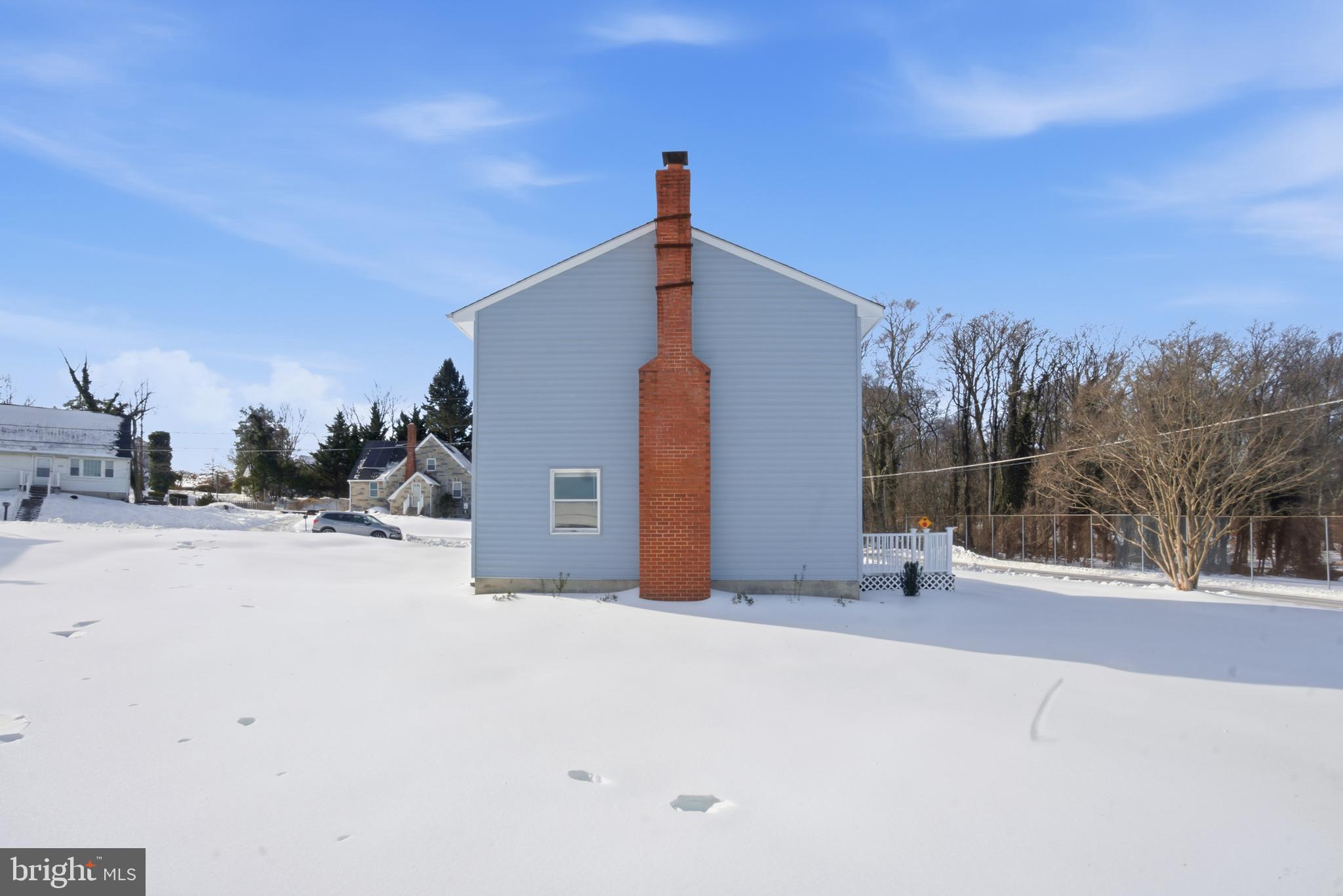 5605 Shelbourne Road, Unit B Baltimore, MD 21227 - Photo 20 of 20 a view of a house with a snow on the road