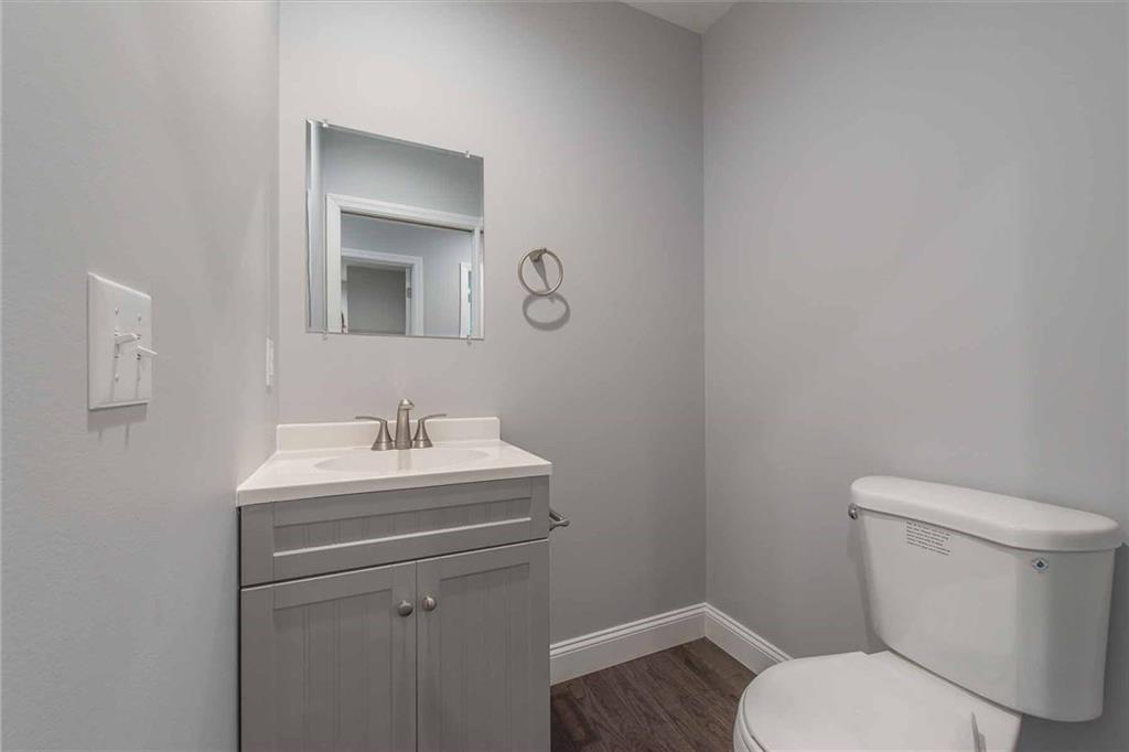 226 McCoy Place Road Sewickley, PA 15143 - Photo 11 of 25 Main level powder room with modern, neutral feel and vanity with storage for towels and supplies.