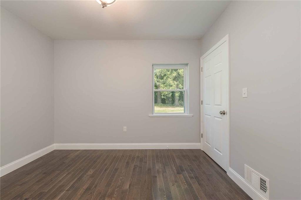 226 McCoy Place Road Sewickley, PA 15143 - Photo 15 of 25 Main level 2nd bedroom features wood floors and a lovely view.