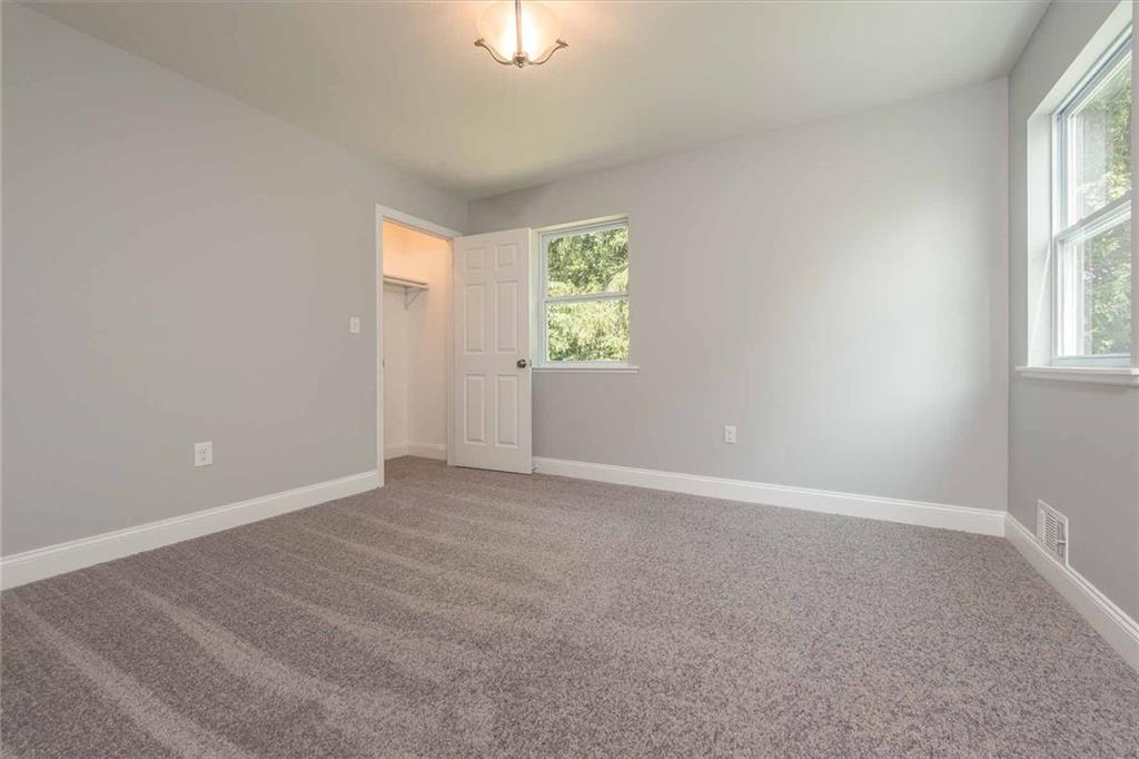 226 McCoy Place Road Sewickley, PA 15143 - Photo 18 of 25 Upstairs additional bedroom is spacious and takes advantage of the wooded views.