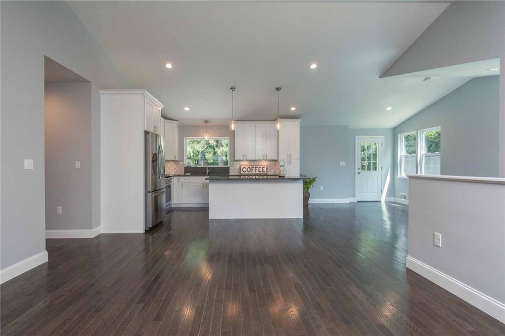 This expansive living room space provides room to spread out. Open to the kitchen for modern living at its best.