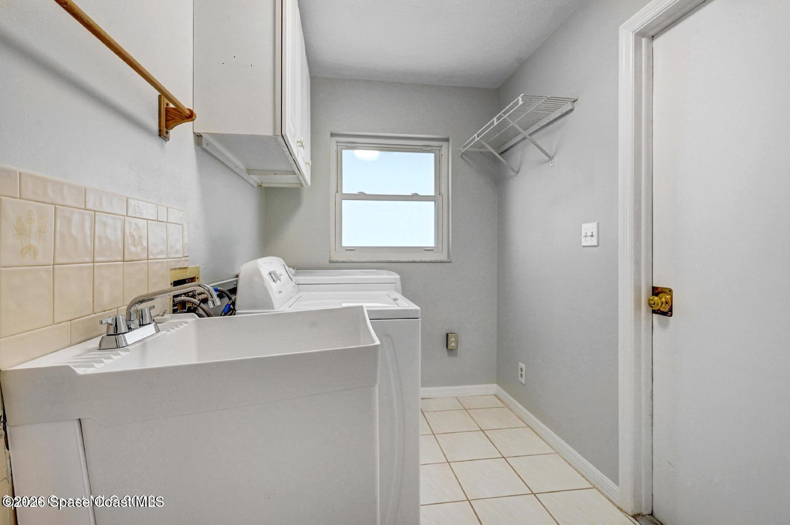 296 Sandy Run Melbourne, FL 32940 - Photo 17 of 23 a bathroom with a sink a toilet and mirror