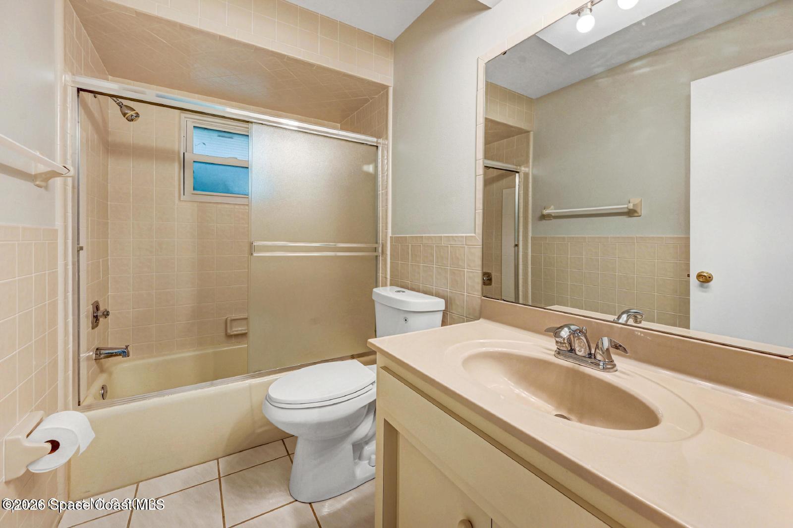 296 Sandy Run Melbourne, FL 32940 - Photo 18 of 23 a bathroom with a granite countertop sink toilet and shower