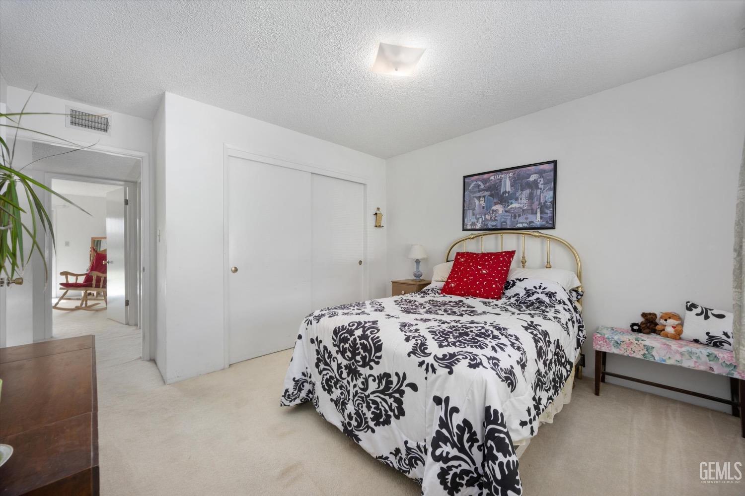 Undisclosed Address Bakersfield, CA 93311 - Photo 20 of 35 a bedroom with a bed and a couch