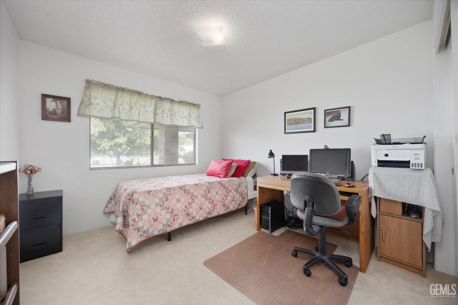 Undisclosed Address Bakersfield, CA 93311 - Photo 22 of 35 a bedroom with a workspace