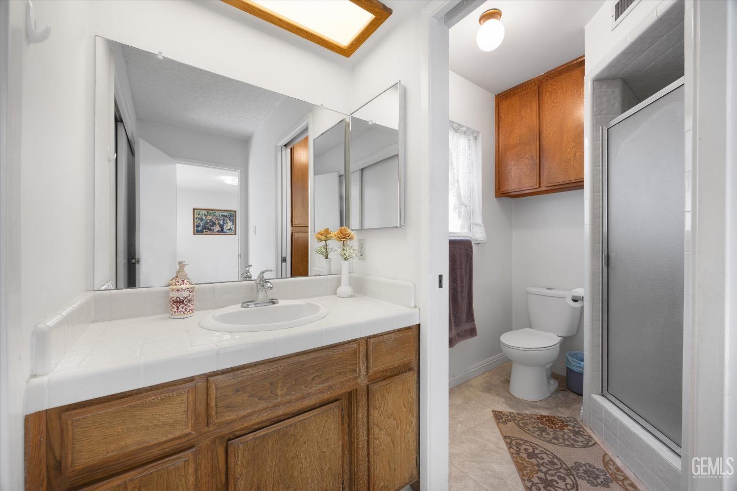 Undisclosed Address Bakersfield, CA 93311 - Photo 24 of 35 a bathroom with a sink and a mirror