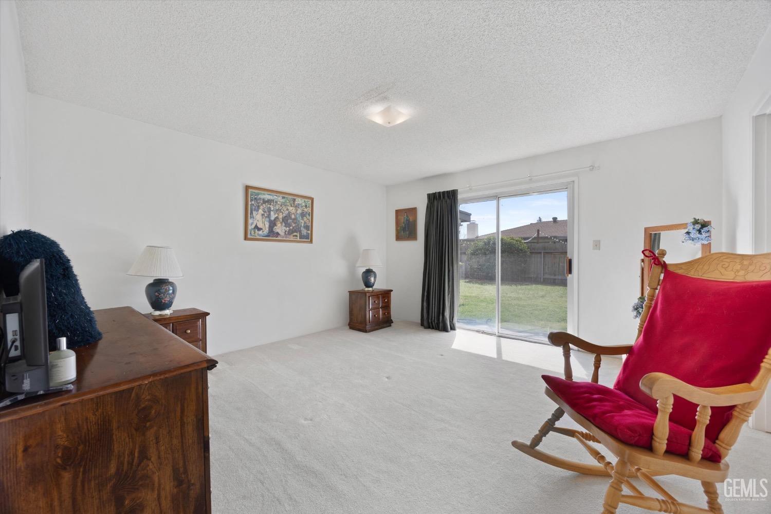 Undisclosed Address Bakersfield, CA 93311 - Photo 25 of 35 a room with furniture and a large window