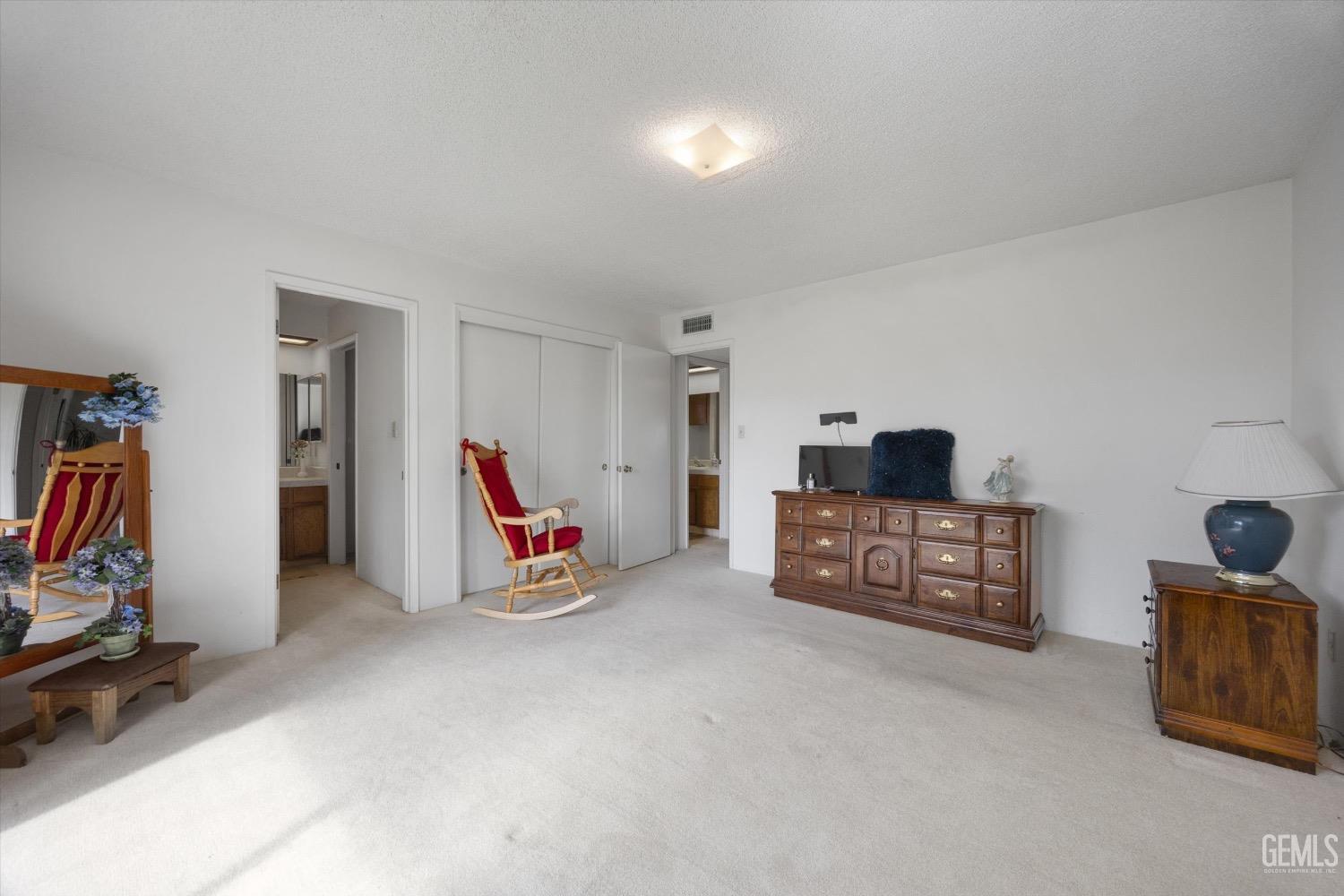 Undisclosed Address Bakersfield, CA 93311 - Photo 26 of 35 a bedroom with furniture and white walls