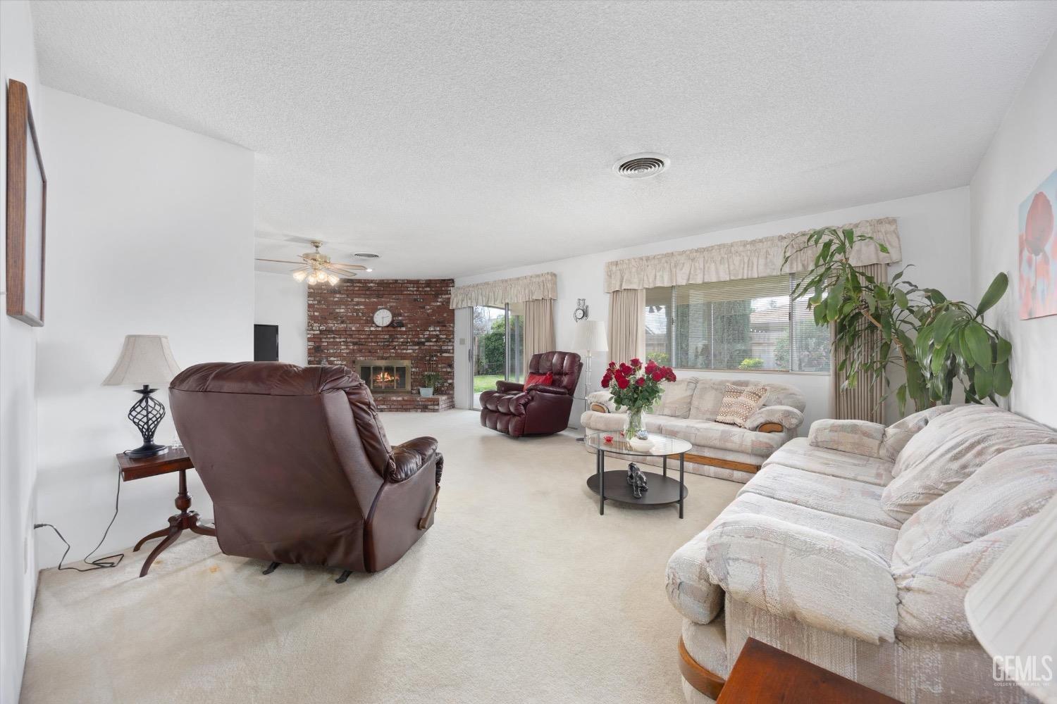Undisclosed Address Bakersfield, CA 93311 - Photo 8 of 35 a living room with furniture and a potted plant