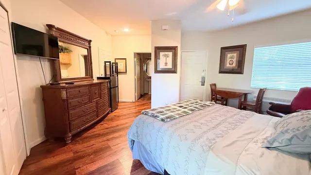 a bed room with two bed and a television