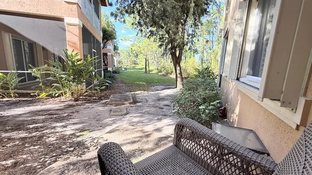 a view of balcony with furniture